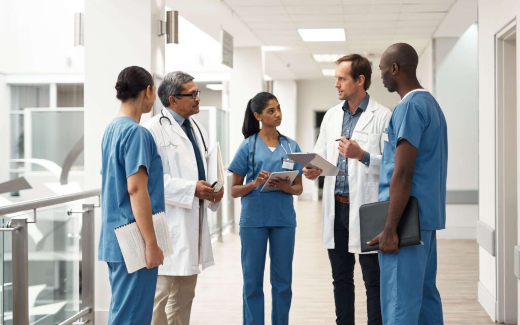Multidisciplinary clinical team conducting a collaborative review—supporting system-wide ECMO program assessment and workflow alignment.